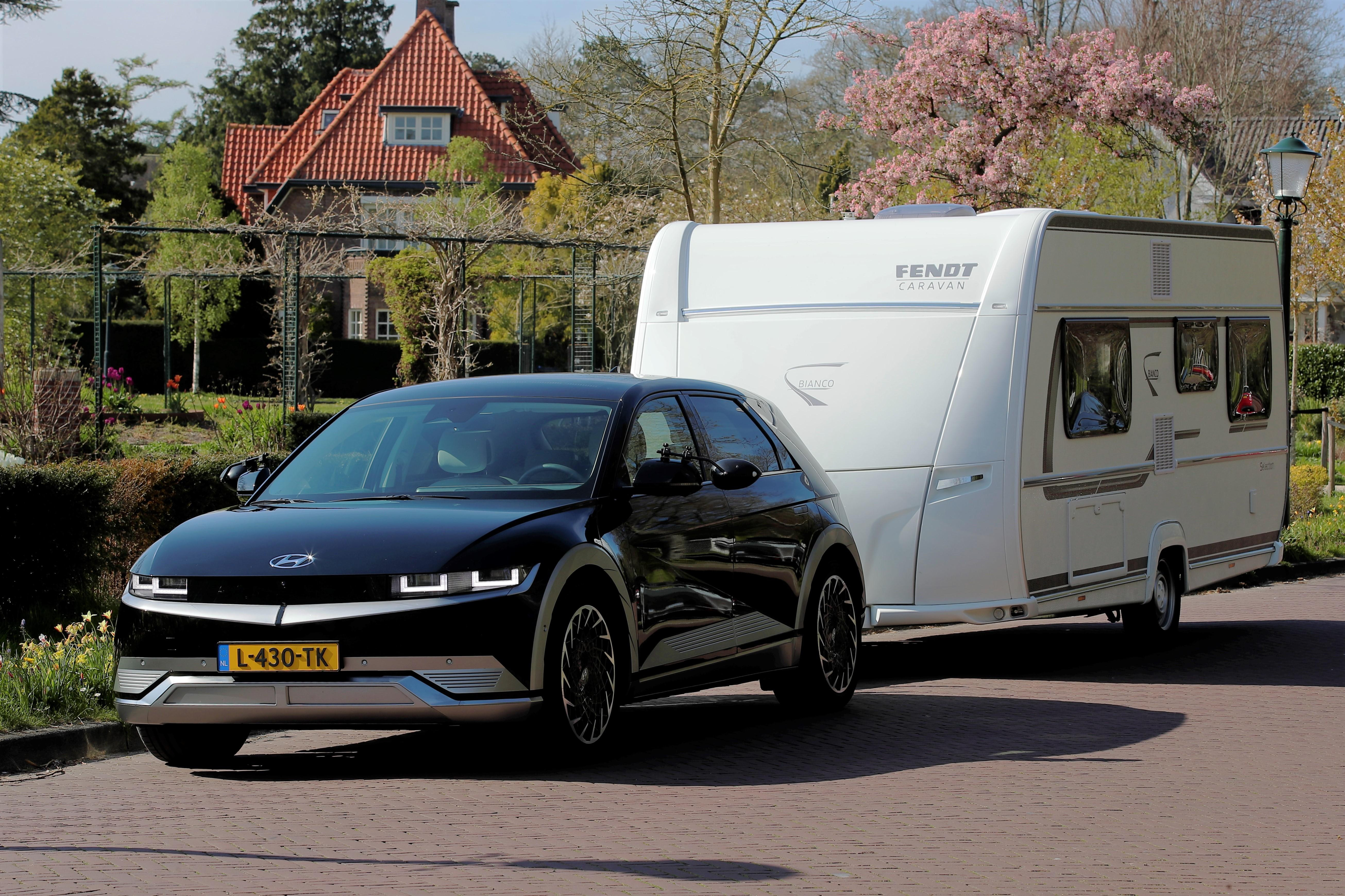 electric car towing a caravan